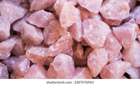 Rose quartz crystals background, often used as home decoration or talismans for its healing properties or romantic energy or used in ceremonies and rituals for its symbolic aura of love or attraction