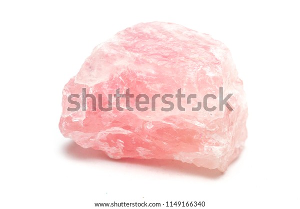 Rose quartz\
mineral isolated on white\
background