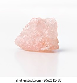 Rose Quartz Raw Silicon Dioxide Mineral Isolated On White Background. Shiny Stone Used For Jewelry With Spiritual And Esoteric Properties. 