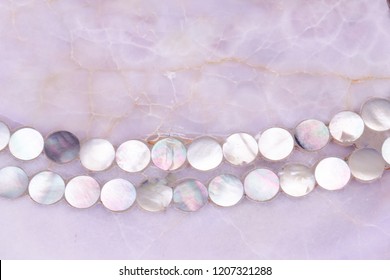 Rose Quartz Texture With Small Mother Pearl Shells Necklace Ornament, Rose Pink Quartz Gemstone Surface Background With Round Mother Pearl Ornament