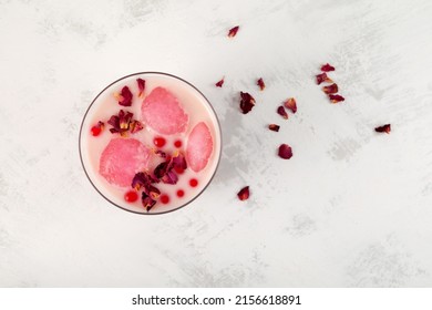 Rose Refreshing Iced Milk Cocktail. Iced Drink, Rose Moon Milk With Fruits Ice. Boba Drink Or Bubble Tea. Top View, Selective Focus.