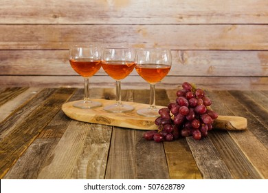 Rose Wine Flight And Grapes