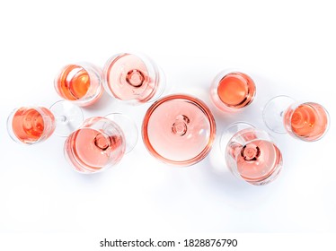 Rose wine glasses on wine tasting. Degustation different varieties of pink wine concept. White background, top view, hard light 