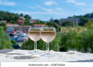 Rose Wine Of Provence, France, Served Cold On Outdoor Terrace In Two Wine Glasses In Sunny Day