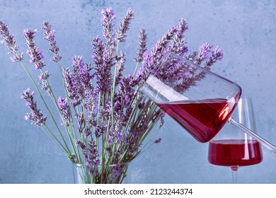 Rose Wine In Trendy Glasses And A Bouquet Of Lavender Flowers, A Vin De Provence Wine Tasting