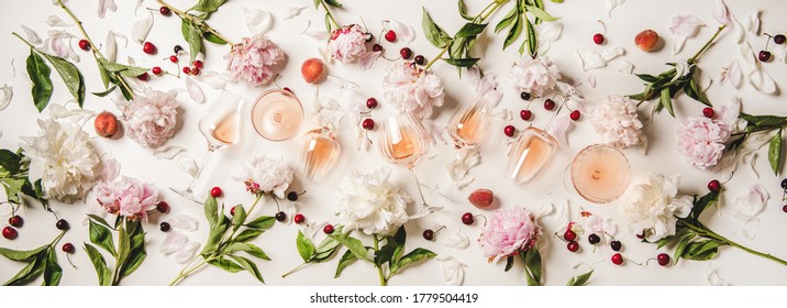 Rose Wine Variety Layout. Flat-lay Of Rose Wine In Various Glasses With Flowers And Summer Fruit Over Plain White Background, Top View. Summer Drink For Party, Wine Shop Or Wine Tasting Concept