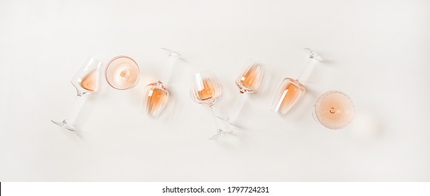 Rose Wine Variety Layout. Flat-lay Of Rose Wine In Various Glasses Over Plain White Background, Top View. Summer Drink For Party, Wine Shop Or Wine Tasting Concept