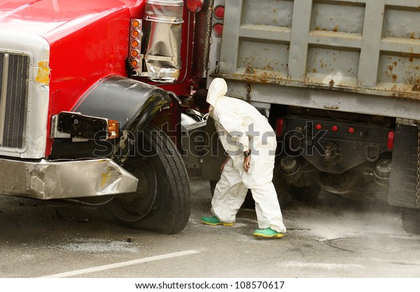 ROSEBURG, OR - JULY 20: Hazardous materials\
cleanup company at a  four vehicle accident involving two large\
trucks resulted in a single injury and a diesel fuel spill. July\
20, 2012 in Roseburg\
Oregon