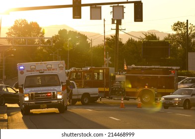 ROSEBURG OR, USA - JULY 12, 2014: Roseburg Oregon Police And Fire Deparment At The Scene Of A Single Car Accident That Knocked Over A Fire Hydrant, July 12, 2014