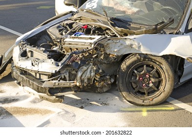 ROSEBURG, OR, USA - MAY 30, 2014: Police And Fire Fighters Survey The Scene Of A Single Vehicle Accident Due To Excessive Speed Sends The Driver To The Hospital In Roseburg, OR, On May 30, 2014