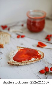 Rosehip jam spread on bread