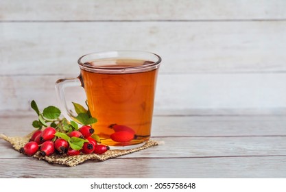 Rosehip Tea On A Wooden Background 