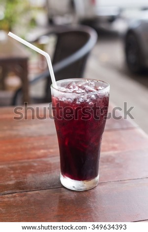 roselle mocktail drink on wooden table