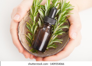 Rosemary essential oil and fresh herbs