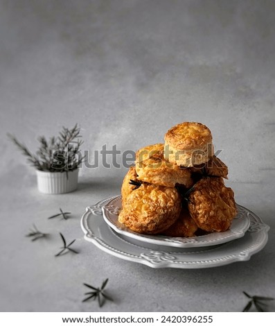 Rosemary infused cheddar scones ready to serve sean catured in evening sunlight