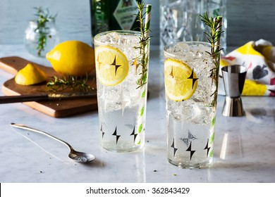 Rosemary Lemon Gin Fizz Alcoholic Cocktail On Bar With Ingredients