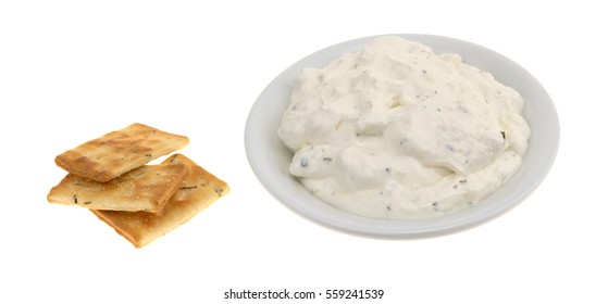 Rosemary And Olive Oil Seasoned Crackers To The Side With A Bowl Of French Onion Dip Isolated On A White Background.