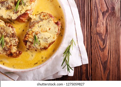 Rosemary Pork Chops In Creamy Sauce On Plate