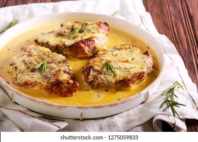 Rosemary Pork Chops In Creamy Sauce On Plate