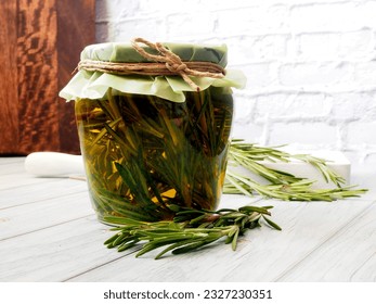 Rosemary-infused Olive Oil Jar on white background. - Powered by Shutterstock