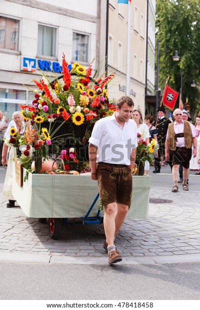 Rosenheim, Germany - September 4, 2016: Flower\
Cart of the Urban Community of Rosenheim Small gardener at\
Thanksgiving Parade in Rosenheim /\
Germany