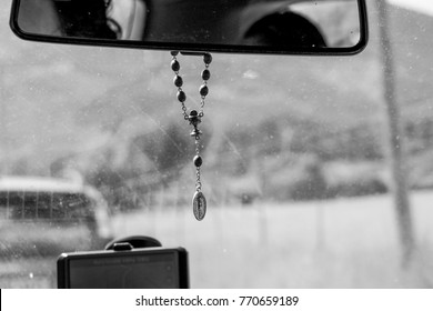 Rosery beads inside the car, God takes care of us