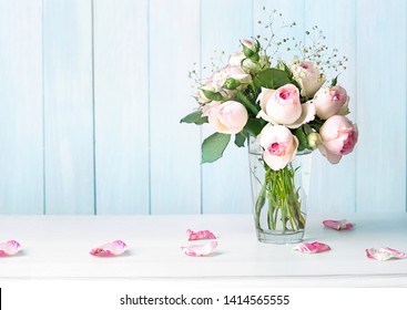 Roses flowers bouquet in vase on table empty copy  space background.