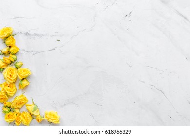 roses frame for spring design on marble background top view mock up