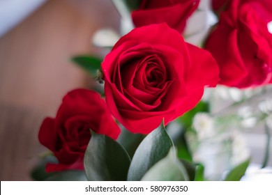 Roses with small white flowers - Shutterstock ID 580976350