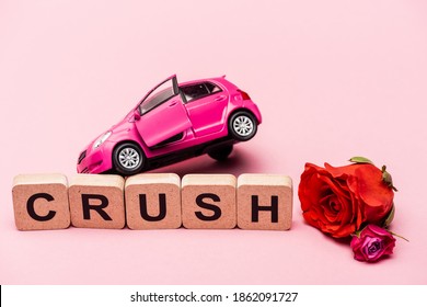 Roses, Toy Car And Word Crush On Cubes On Pink Background