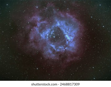 The Rosette Nebula is a diffuse emission nebula with an embedded open star cluster in the constellation Monoceros. The open star cluster NGC 2244 makes the nebula glow.