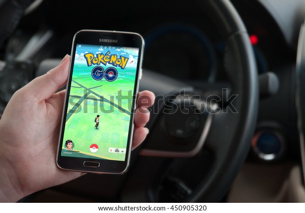 Roseville, CA/USA - July 11,\
2016: An Android user plays Pokemon Go in a car, a free-to-play\
augmented reality mobile game developed by Niantic for iOS and\
Android devices.