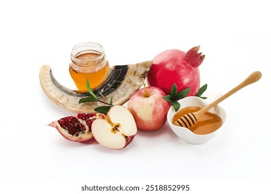 Rosh Hashanah Holiday Symbols. Traditional Rosh Hashanah items including pomegranate, apple, honey, and shofar