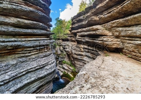 Rosomacki Lonci (canyon of river Rosomaca) in Stara Planina mountains are called Rosomacki pots, because of the unusual shape, edges layered with multiple extensions with whirlpools