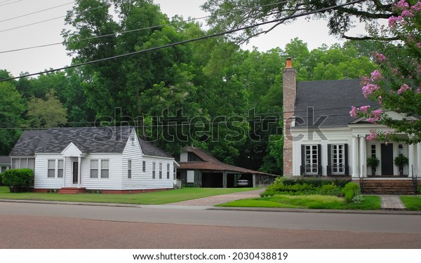 Rossville, Tennessee United\
States - July 15 2021: a historic home with the original barn\
behind it