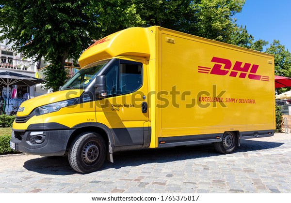 ROSTOCK, GERMANY - JUNE 15, 2020:\
DHL delivery van. DHL is a division of the German logistics company\
Deutsche Post AG providing international express mail\
services.