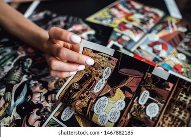 ROSTOV-ON-DON / RUSSIA - August 1 2019: Hand Flipping Through Comic Book Pages. Comics Background 