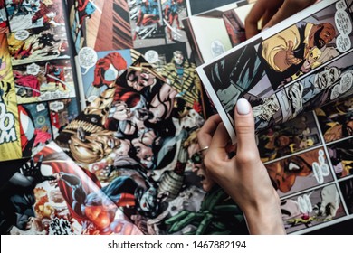ROSTOV-ON-DON / RUSSIA - August 1 2019: hand flipping through comic book pages. Comics background 