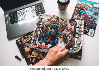 Rostov-on-Don / RUSSIA - August 27 2020 : Man Reading Comic Books On The White Table In Between Work.