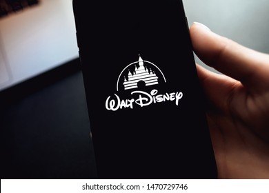 ROSTOV-ON-DON / RUSSIA - August 5 2019: Hand Holding The IPhone X With Disney Logo On The Screen. Disney Background 