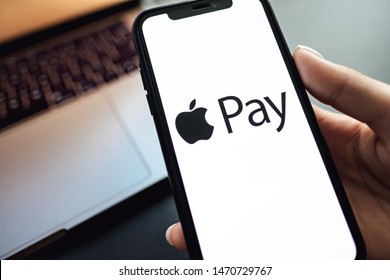 ROSTOV-ON-DON / RUSSIA - August 5 2019: Hand Holding The IPhone X With Apple Pay Logo On The Screen.
