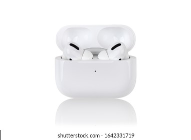 Rostov-on-Don, Russia - December 2019. Apple AirPods Pro on a white background. Wireless headphones in a charging case close-up.