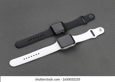 Rostov-on-Don, Russia - December 2019. Two smart watchesApple Watch on a gray background. New smart watches from APPLE company close-up.