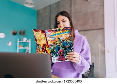 Rostov-on-Don, Russia - February 19 2021 : Young Woman Reading Comic Books At Home.