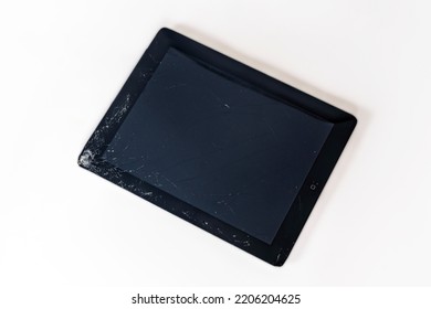 Rostov-on-Don, Russia - July 23 2021: Tablet Computer Apple IPad With Broken Screen Glass, The Result Of Falling Or Crash. White Background, Copy Space.