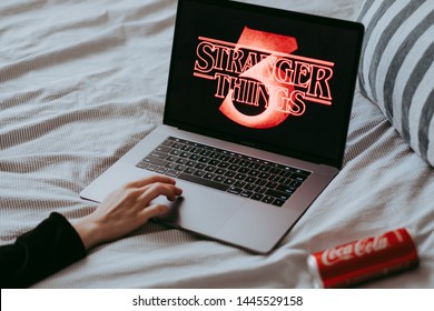 ROSTOV-ON-DON / RUSSIA - July 8 2019:
Stranger Things 3 from Netflix TV series Poster,  the laptop with shot of Stranger Things Season 3