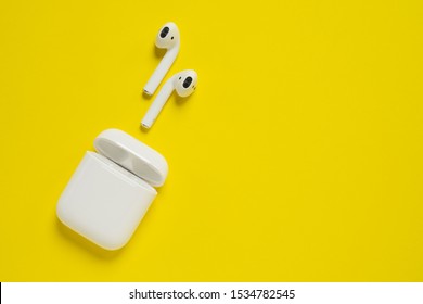 ROSTOV-ON-DON, RUSSIA - October 07, 2019: Apple AirPods wireless Bluetooth headphones and charging case for  Apple iPhone. New Apple Earpods Airpods in box.