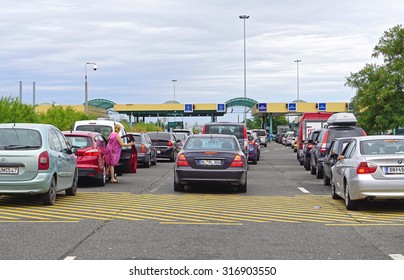 ROSZKE, HUNGARY - JULY 09, 2015: Long Lines At Border Crossing In Roszke, Hungary. Traffic Jam At Customs Checkpoint Between Serbia And Hungary.