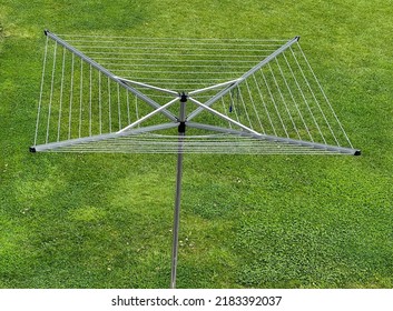 Rotary Clothes Dryer On A Green Lawn