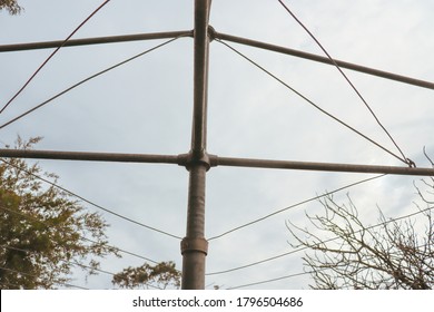 Rotary Clothes Line In Silhouette Against Sky